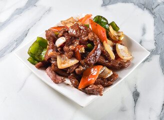 Spicy beef stir-fry with vibrant peppers and onions, perfect for restaurant menus or food blogs seeking authentic cuisine.