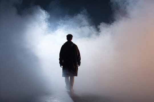 Solitary male silhouette in foggy ambiance