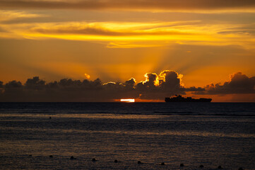 Sunset View of Cargo Ship at Sea