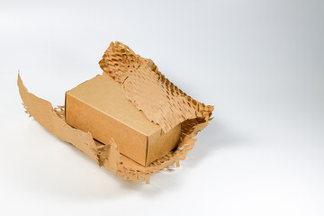 Parcel wrapped in eco-friendly wrapping paper, lightweight bubble wrap for protective packaging, Environmentally friendly Honeycomb paper hexagonal shape made of cardboard recycled craft paper.
