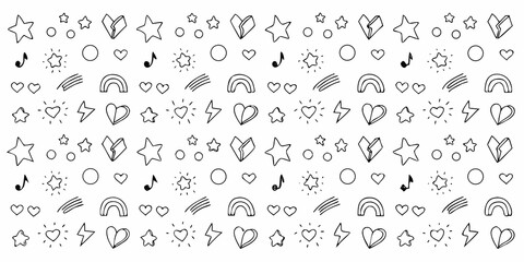 Hand drawn doodle pattern with stars hearts rainbows and musical notes