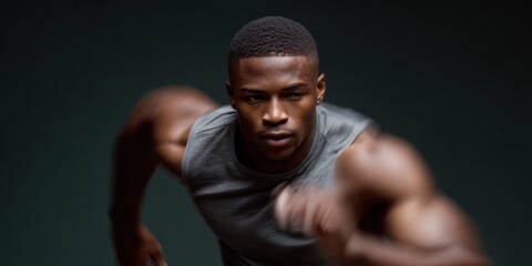Focused african male athlete in motion with intense expression