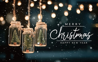 Festive hanging jars with miniature Christmas trees inside against a snowy, bokeh light background.