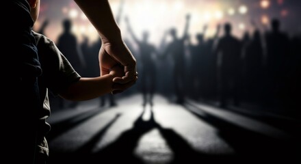 Kid holding parent hand in blurred crowd of silhouettes. Child protection and guidance in complex social environment. Childhood development concept.