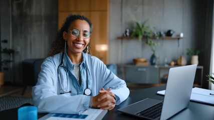 Smiling Medical Professional at Desk: A warm and inviting portrait of a healthcare worker, radiating positivity, seated at her desk, showcasing her dedication and the essence of care. 