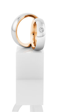 Still life of wedding rings on a white pedestal