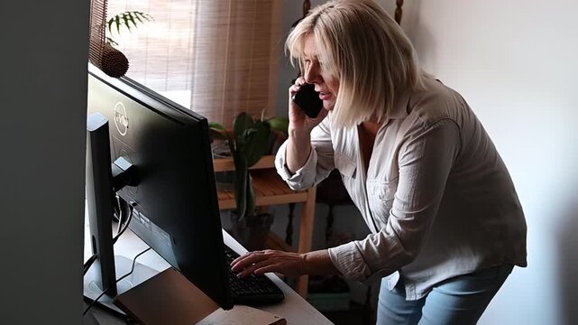 Stressed senior businesswoman arguing on the phone