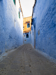 Blue-painted streets of Chefchaouen in Morocco, featuring traditional architecture, narrow alleys, and vibrant urban charm.