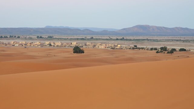 Video of Merzouga in Morocco, featuring the golden Sahara dunes, desert landscape, and peaceful natural scenery.
