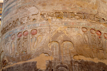 Ancient Egyptian hieroglyphs on stone wall, Karnak Temple Complex, Luxor, Egypt, Africa. Stone carvings with hieroglyphs at Karnak temple, Luxor, Thebe