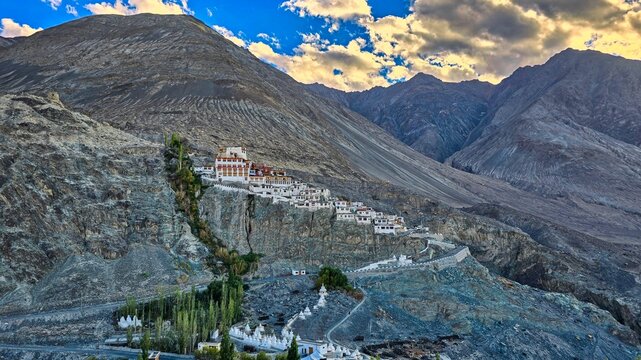 Stunning Diskit Monastery, an ancient Buddhist gompa, stands isolated on rocky hill in Nubra Valley, representing spiritual resilience in high Himalayas. Ladakh Region, India - Powered by Adobe