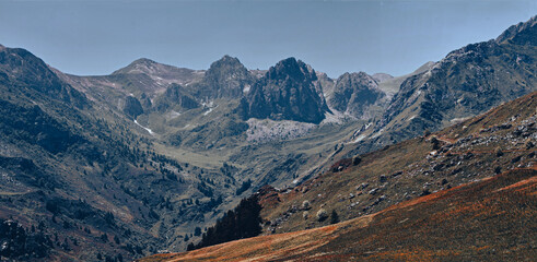 The view of the Alps in Valle Grana, Italy, reveals majestic mountain scenery with snowy peaks and verdant valleys. It is the perfect place for tranquillity and inspiration.