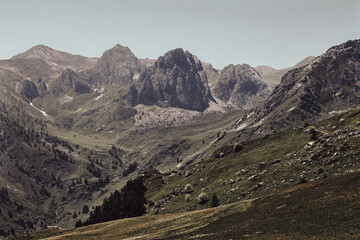The view of the Alps in Valle Grana, Italy, reveals majestic mountain scenery with snowy peaks and verdant valleys. It is the perfect place for tranquillity and inspiration.