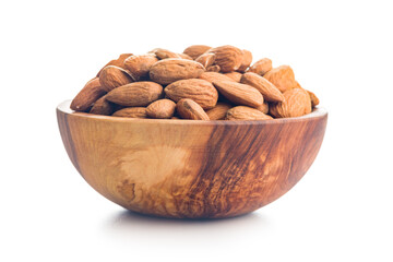 Almond kernel nuts in bowl isolated on white background.