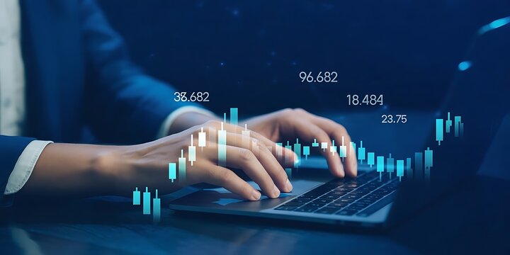 Hands typing on laptop overlaid with glowing candlestick charts and financial data, representing market analysis and crypto trading concept. Business