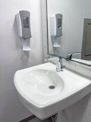 Looking down on a public restroom with sink and faucet