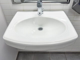 Looking down on a public restroom with sink and faucet