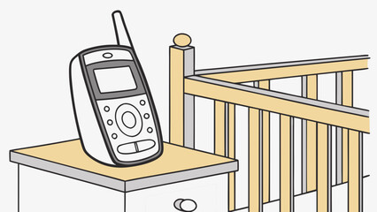 Baby monitor on nightstand next to crib for keeping watch on child. Baby monitor features clear display and controls for ambient noise monitoring