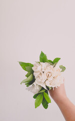 a lovely bouquet of jasmine in the bride's hand
