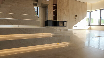 Modern interior with marble staircase and ambient lighting
