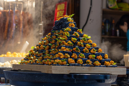 Changsha stinky tofu sold on the street in China.