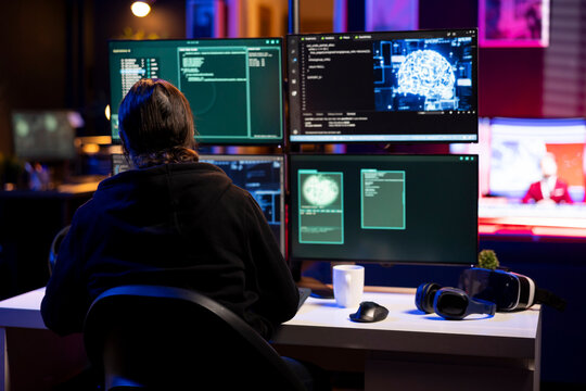 Hacker in underground lair installing spyware secretly gathering data about user activity. Cybercriminal coding exploits taking advantage of bugs to gain unauthorized access