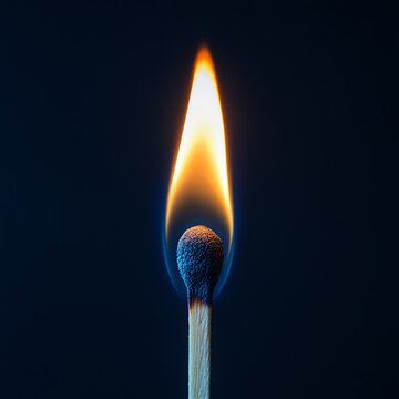 a single ignited matchstick but with an intense blue and white flame burning brightly against a dark navy background    high resolution   for isolate image