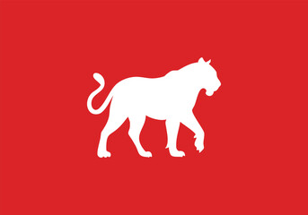 Tiger silhouette logo design. Simple animal shape icon isolated on red background.