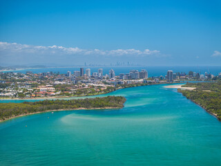 Elevated aerial views of  the Tweed River inlet with the Coolangatta and Tweed Heads skyline visible in the background, New South Wales, Australia