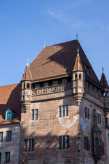 Obraz premium Nassauer Haus in Karolinenstraße, Nuremberg, Germany — medieval tower house with Gothic architecture, red sandstone facade, and historic charm in the city center. 