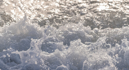 Sea Waves Glowing at Dawn in Warm Morning Sunlight