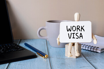 On the table is the flag of Germany, a pencil, a magnifying glass - Work Visa