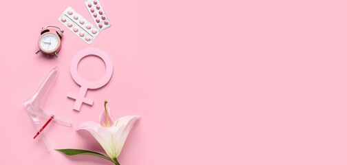 Gynecological speculum with flower, symbol of woman, alarm clock and pills on pink background with...
