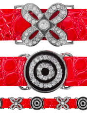 Seamless isolated photo of red embossed leather straps with decorative metal buckles with stones.