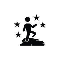 Black silhouette icon of a person achieving success, standing on a rock surrounded by stars, symbolizing accomplishment and recognition.