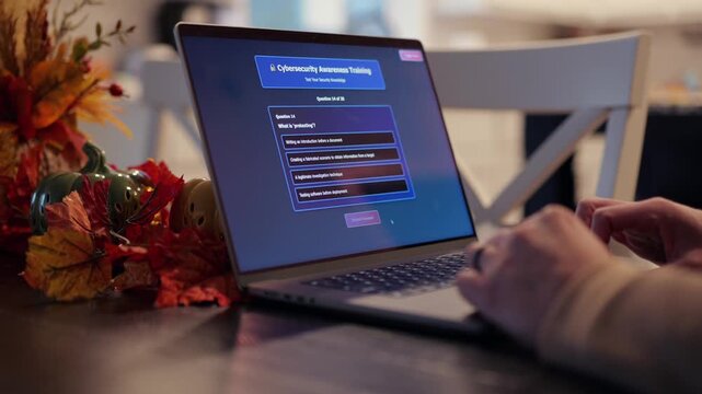 Middle Aged Man Working from Home Takes IT Security Awareness Training from Kitchen Table - Cybersecurity Education for Remote Employees Concept