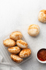 Overhead view of a plate of masa and pepper sauce, top view of food from northern nigeria masa rice cake and stew, nigerian ethnic foods