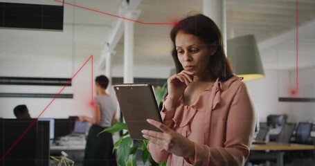 Female manager tapping tablet and activating red overlay, aligning desks for business review