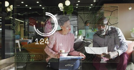 Woman reaching for doc while man leaning, checking business data with AR ring expanding then fading - Powered by Adobe