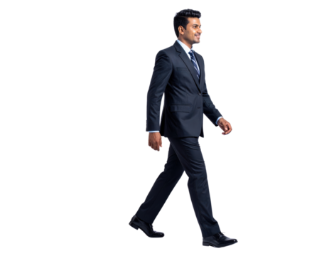 Confident businessman in a dark suit walking with purpose.