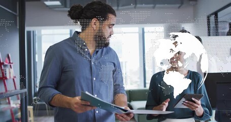 Man explaining folder, woman tapping tablet reviewing business project, globe drifting across faces - Powered by Adobe