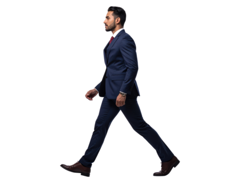 Confident young businessman walking with purpose in a professional suit.