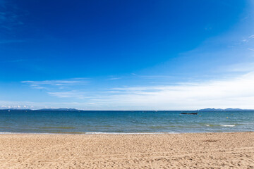 Panorama of Plage de Miramar Beach in La Londe les Maures, France, on French riviera, in Var, with Mediterranean Sea and Iles d'Or. Sandy shoreline, and blue sky depict a Cote d'Azur seascape.