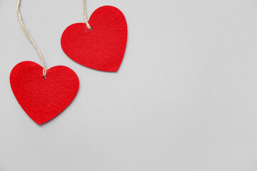 Heart shaped decorations with ropes on white background. Valentine's Day celebration