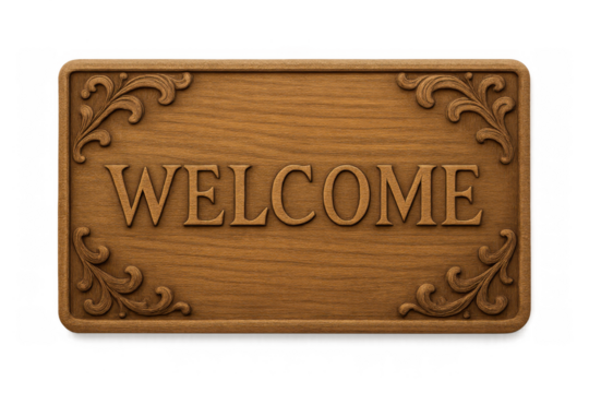 Welcome sign on a carved wooden plaque with ornamental corners offering a warm greeting and hospitality