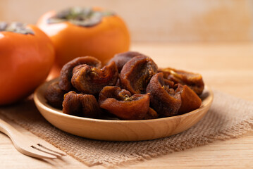 Dried persimmon on wooden plate ready to eating, Sweet and chewy
