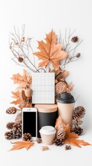 A flat lay composition featuring autumnal elements like leaves and pine cones surrounding a smartphone and coffee cups.