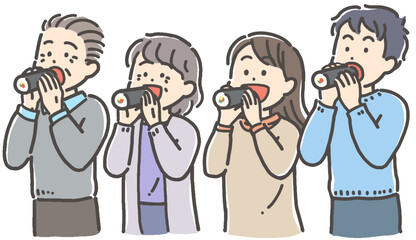 節分の恵方巻（太巻き）寿司を食べる男女4人  © タダエミコ Emiko Tada