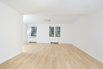 Bright empty white room with natural wood floors