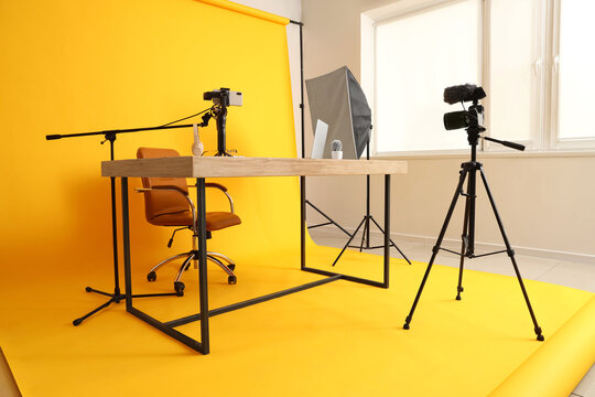 Interior of blogger's studio with workplace and professional equipment - Powered by Adobe